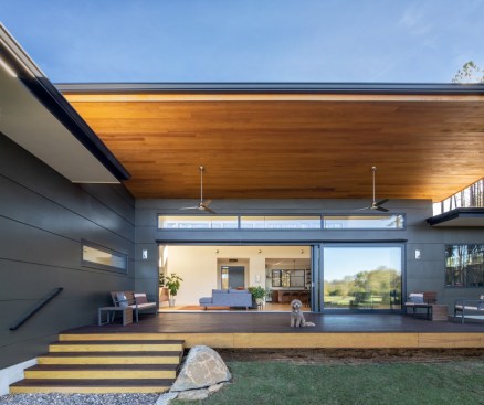 Indoors and outdoors become one extended living space when the wall-sized sliding glass doors are open.