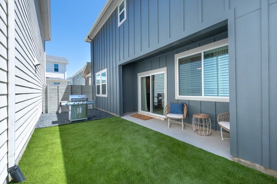 With alley-loaded garages, the homes include a private side yard for outdoor space.