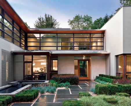 Formal, yet eclectic plantings extend the building's geometry into the landscape.