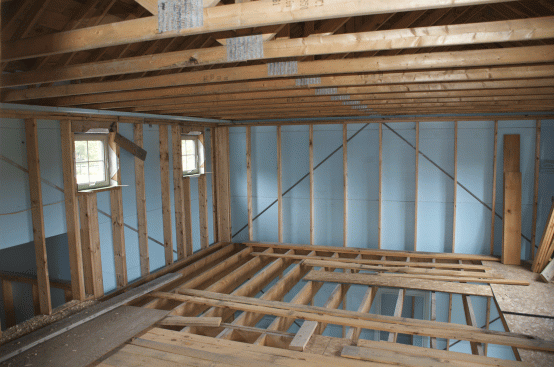 2-inch extruded polystyrene blue board, shown here on the second floor, runs continuously around the
slab up the walls to the roof.
