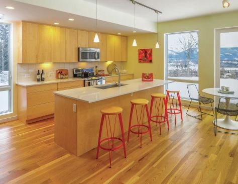 Built of recycled steel framing, and including high R-value walls and other energy-efficient products and techniques, the home fullfilled the developer's sustainability requirements. Its butterfly roof can also be outfitted with solar panels.