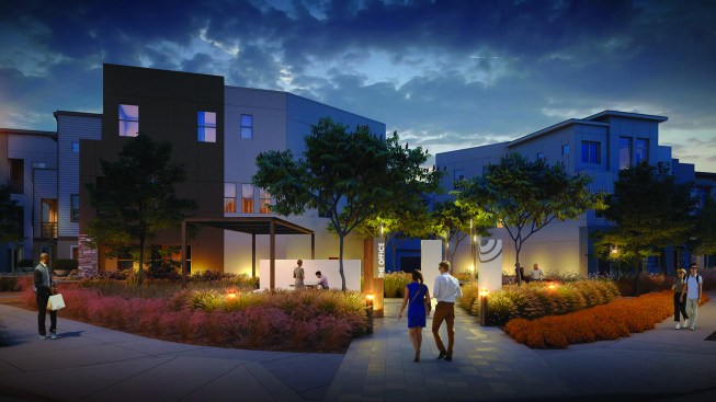 Rendering of The Office with conference table and tall wall for presentations.