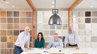 CEO Ken Balogh, regional president Lindsay Motley, COO Ryan Lewis, and CFO Zack Sawyer in the Ashton Woods Studio, a space where designers help prospective buyers make their design selections.