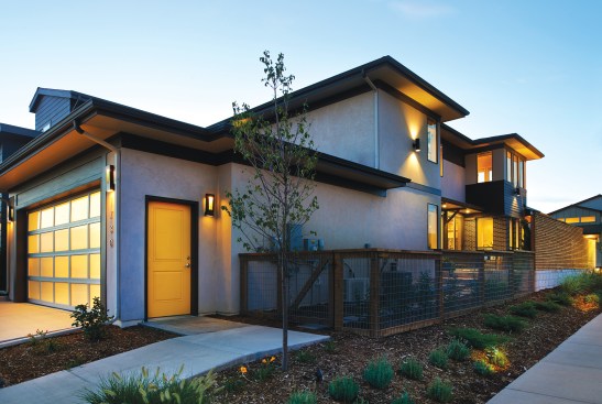 Midtown: Translucent garage doors help the alley glow at night, so they are not dead spaces. Added bonus: you get natural light inside the garage.