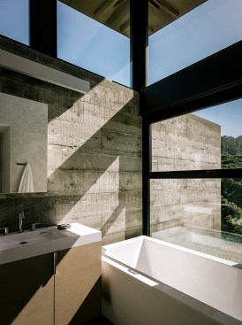 Raw materials in this bath lend to a natural, organic experience. Project: Butterfly House by Feldman Architecture 
