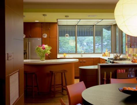 Formed by logical circulation patterns, the boomerang island serves as a command center for the busy household.