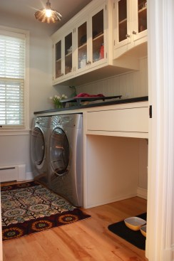 This farmhouse had received several updates and renova-
tions over the years. However, the floor plan was conflict-
ing amongst the kitchen, laundry, mudroom, and powder 
room. A complete reorganization of the first floor was 
achieved through multiple structural changes that al-
lowed for a larger kitchen and created better flow be-
tween adjacent rooms. The kitchen includes custom 
painted cabinetry, a farmhouse style sink, and soapstone 
countertops. A commercial size Viking range, hood, and 
Sub Zero refrigerator bring a theme of stainless steel to 
the kitchen which is accentuated by brushed nickel hard-
ware and island faucet. Specialty lighting, glass door 
cabinets, and a grand, eight foot island are just a few of 
the features that make this kitchen stunning.