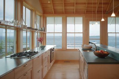 Unlike the original flimsy fishing shack on the property, which blew across the road several times during hurricanes, this one sports smart, practical materials such as a metal roof, cellular PVC trim, and prefabricated galvanized structural ties, brackets, and rail supports.
