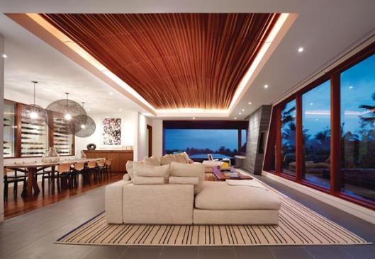 The living room's CNC-cut glulam ceiling evokes a grass skirt.
