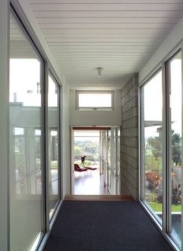 View from glass-enclosed bridge into new master bedroom.