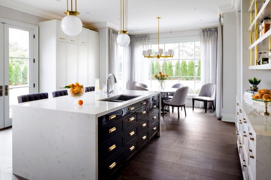 Cambria Torquay featured with black lacquered cabinets and gold hardware pairs perfectly to create a sophisticated luxe look.