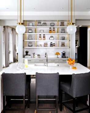 A Torquay waterfall kitchen island provides a luxe marble look. Design by: Gluckstein Design. 