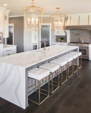 White on white with Brittanicca + brass accents create an elevated and inviting environment. Design by: Michael Paul.