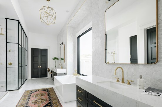 Dual Swanbridge vanities bring spa-like luxury to this master bath. Space by AFT Construction and E. Interiors.
