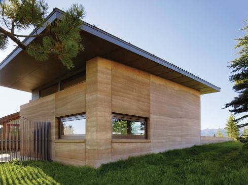 The overhand for the studio addition is deeper above the shower, partly to shade bathers, but also to protect the rammed earth, which will slowly erode over time. “The simple curved shower fixture is also really interesting,” Mei adds, “so we had the exposed plumbing come directly out of the wall. The stainless steel looks great against the rammed earth.”