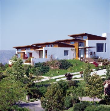 Stained cedar adds warmth, and clerestory windows maximize views of the rolling landscape and distant mountains.