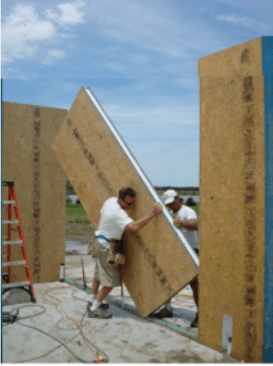Figure 1: Carl Franklin Homes constructing walls with 4’ SIP wall panels.