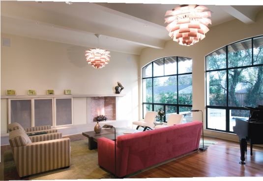 The home’s architecture combines elements of Tuscan farmhouses, such as arched doorways and stone walls, with loft-like high ceilings and an open floor plan.