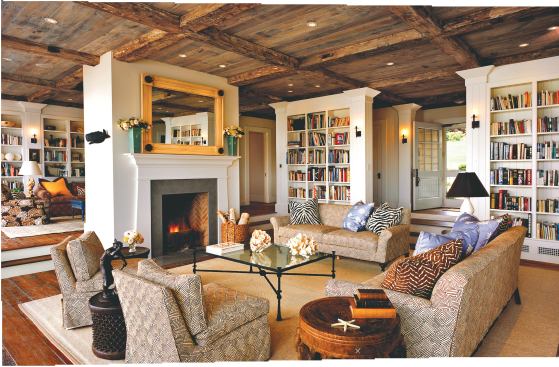 Reclaimed barn wood appears on the ceilings and floors throughout the main living space (this page) and kitchen (opposite), accentuating the house’s hand-hewn feeling.