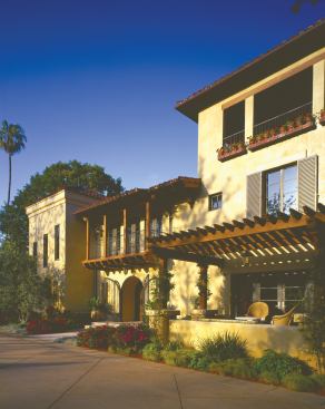 A series of moves—such as resurfacing interior walls and floors, adding ceiling beams, and changing exterior colors and detailing—introduce an Old World atmosphere.