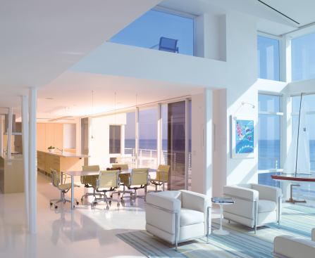 By stringing the house along the shoreline, the architects made sure its rooms boast generous ocean views. Monochromatic finishes and furnishings play up the eye-catching scenery.