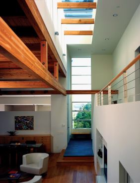 The central stair tower infuses the interiors with natural light.