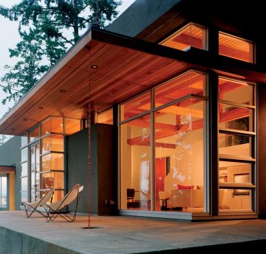 A grand cantilever provides shelter and a bit of drama to match the splendor of the surrounding Douglas firs.