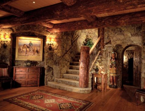 After these photographs were taken, a chainsaw sculptor carved the massive log newel post—in place—in the image of a beaver.