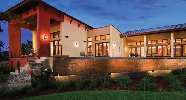 (Top right) Curved elements, such as the shower, tub, and vanity, help set the master bath apart from the home’s linear exterior (above). Clerestory windows in the main living space (right) connect indoors and outdoors.
