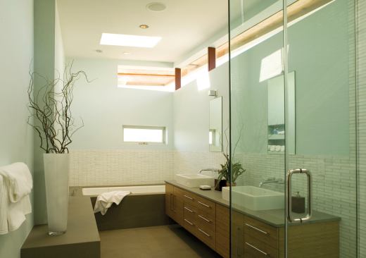 Bands of glass further the horizontal theme of the master bath. Their position maximizes daylighing while limiting outward views.