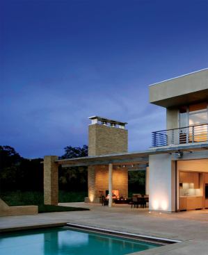 Designed as a family hub for outdoor entertaining, the pool pavilion houses three distinct living spaces. Slotted between the open-air kitchen and the cedar-clad staircase volume is the great room, which adapts to inclement weather with sliding glass doors. Two full baths flanking the U-shaped staircase are accessible from inside and out.