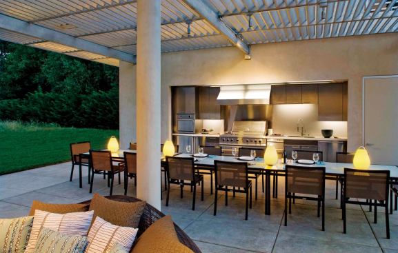 Custom Home March-April 2010  Case Study: Sonoma Flow   Architect and interior designer: zumaooh, Oakland, Calif.; Builder: Caletti Jungsten Construction, Mill Valley, Calif.; Photographer: David Wakely Photography.   The metal overhead grid shades the kitchen and edges of the east/west-oriented pavilion, its slats angled to block direct sun during the day.