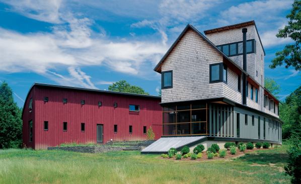 Three traditional building forms—a gable-roofed main house, a shedlike studio, and a saltbox-style loft—come together in an unexpected fashion.