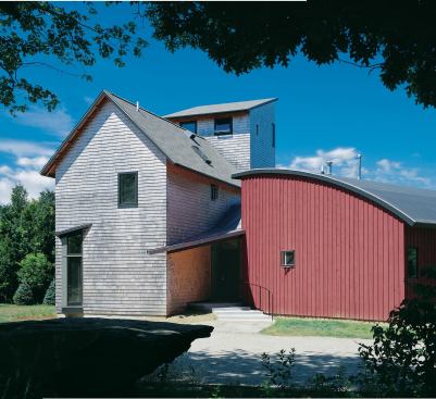 Three traditional building forms—a gable-roofed main house, a shedlike studio, and a saltbox-style loft—come together in an unexpected fashion.