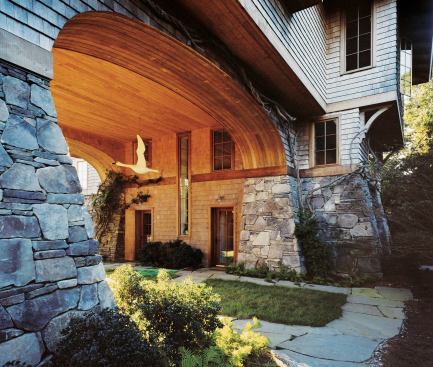 Located in a coastal flood plain, the building concentrates habitable square footage at its upper floors. Leftover space at the lower levels is devoted to a picturesque tunnel.