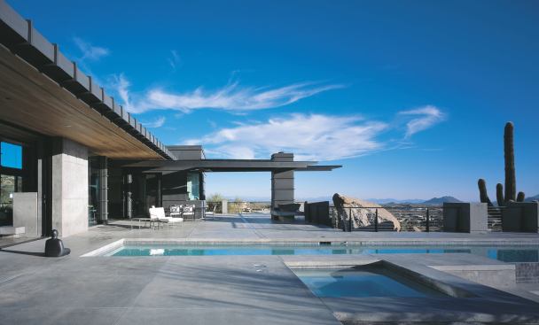 Extensive concrete terraces outside this Scottsdale, Ariz., second home make the most of its sweeping desert views.