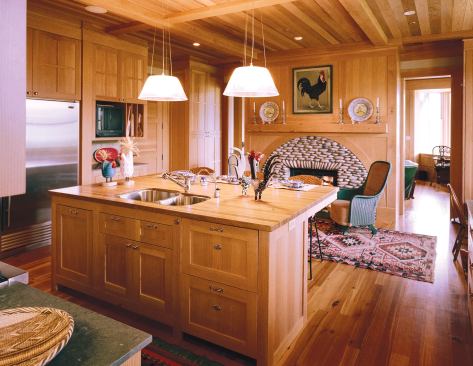 The kitchen leads to a secluded master suite wing, and a second-floor tower holds grandchildren's bedrooms.