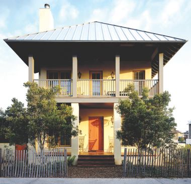 The home's stately façade gives way to an exuberant interior, filled with bright colors and surprising materials.
