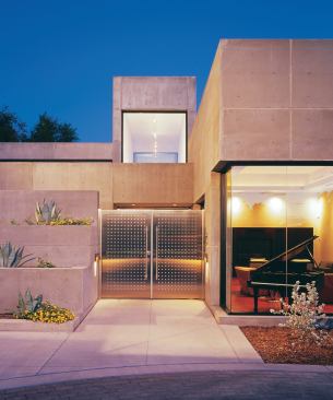 Crystalline geometry and uniform cast-in-place concrete finishes give this home an almost monolithic formality.