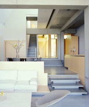 Variations in concrete formwork create a range of finish surfaces in this cast-in-place urban home.