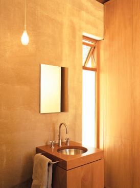 A clear sealer applied to the rammed-earth walls, both interior and exterior, protects them from damage.