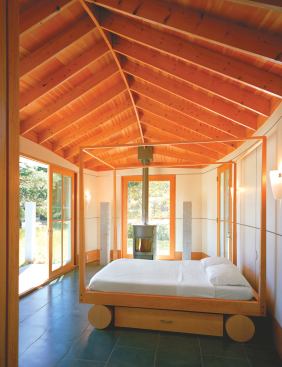 Freestanding fireplaces keep the chill off during the winter, but when the weather’s fine, a wall of sliding glass doors opens to an outdoor living room, bounded by arbors that will one day support grape vines.