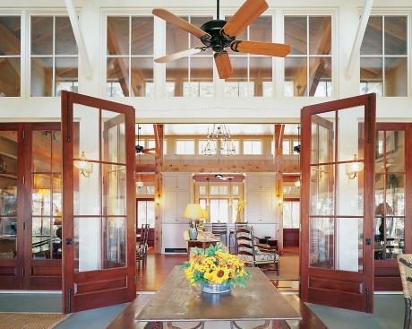 Transom lights and high clerestory windows channel daylight into the core of the house.