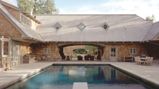 Double sets of pocket doors keep the cabana open or closed to the pool area.