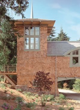 A library tower with its own balcony stands sentinel at the house's entrance.