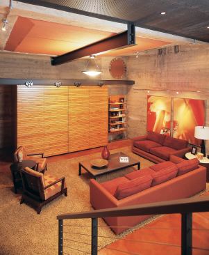 This high-style media bunker occupies the former boiler room of an early-1900s Minneapolis mansion. The painted ceiling, supported by a new steel I-beam suspended from existing concrete beams, replaces an old turntable for the carriage house above. 