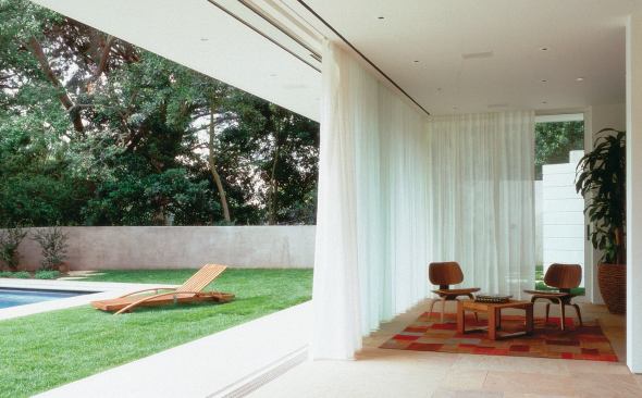 Custom Home Outdoors – Winter 2005 “Open House” from Pool Houses case study Architect: Montalba Architects, Santa Monica, Calif.; Builder: Sarlan Builders, Santa Monica This 680-square-foot pavilion features disappearing glass walls on three sides. A 42-foot cambered steel beam gives the gabled roof enough support so that concrete roof tiles don't put pressure on the sliding glass. Architect David Montalba strengthened the bond between pavilion and pool by making them the same size and shape.