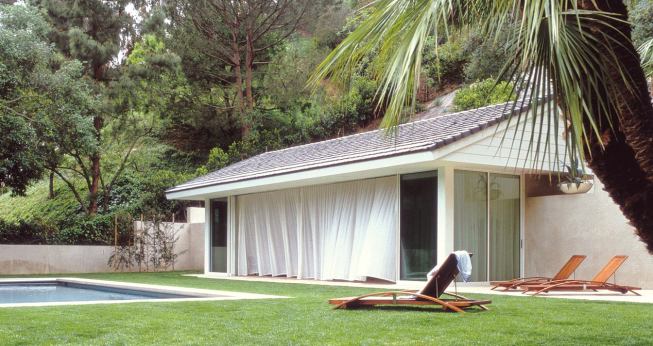 Custom Home Outdoors – Winter 2005 “Open House” from Pool Houses case study Architect: Montalba Architects, Santa Monica, Calif.; Builder: Sarlan Builders, Santa Monica This 680-square-foot pavilion features disappearing glass walls on three sides. A 42-foot cambered steel beam gives the gabled roof enough support so that concrete roof tiles don't put pressure on the sliding glass. Architect David Montalba strengthened the bond between pavilion and pool by making them the same size and shape.