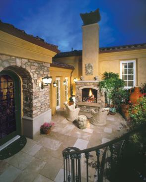 The upper courtyard creates a welcoming entry space that segues either into the foyer or down along the side of the house to the spa and gardens on lower levels. Vasquez chose hard materials like stone and plaster to make the exterior area feel more like a room and encourage its use as a gathering space.