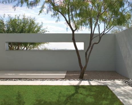 In addition to creating outdoor spaces, walls also generate specific planting areas. Outside the walls, drought-resistant indigenous species give life back to the Arizona desert surrounding the courtyards. Openings frame selected vistas while the walls block unwanted views.